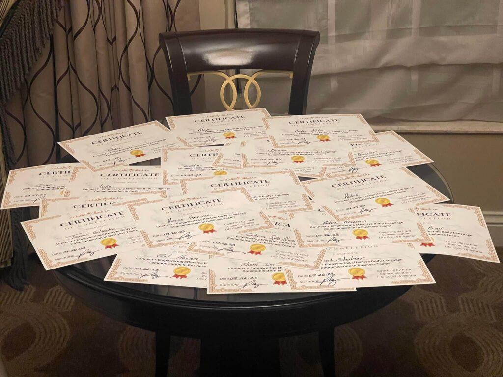 Table covered with certificates ready for distribution after sales training for communication